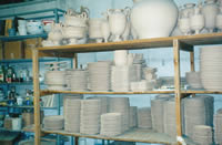 Bisque pottery cooling on racks