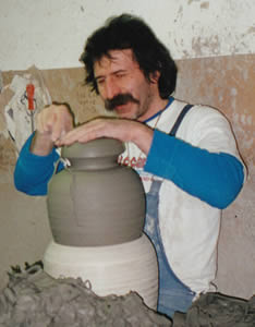 Italian Potter perfecting the shape of the pot